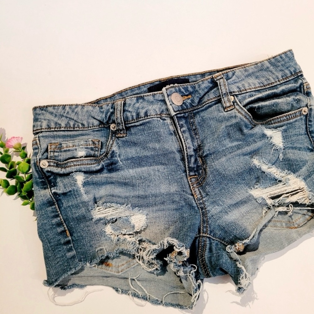 Aero low rise midi distressed jean shorts